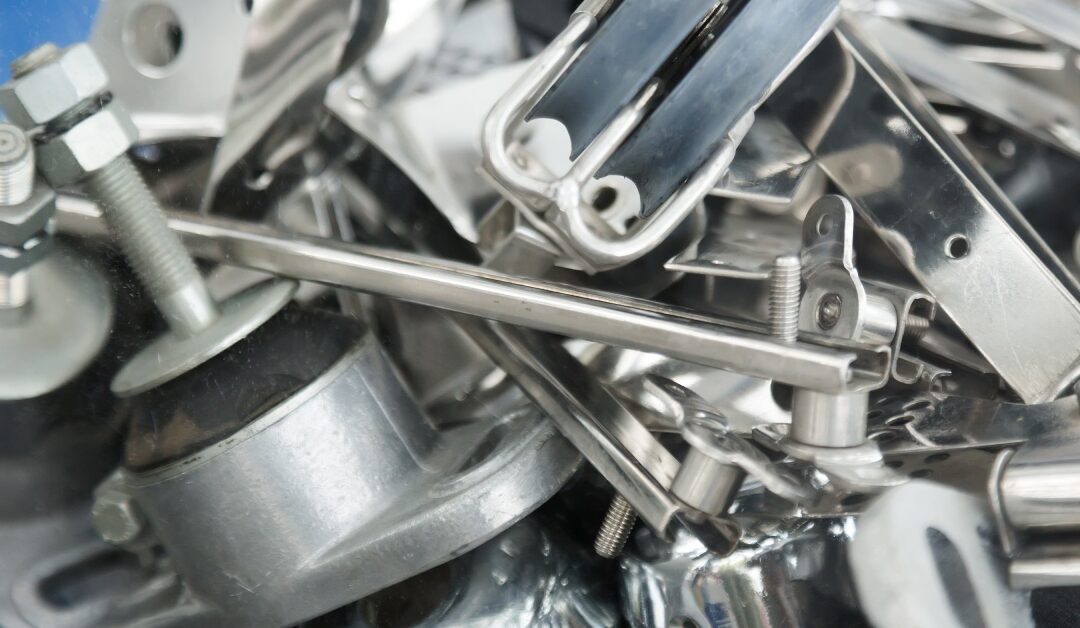 A disorganized heap of various mounting hardware, including screws, bolts, and brackets, resting on a stand.